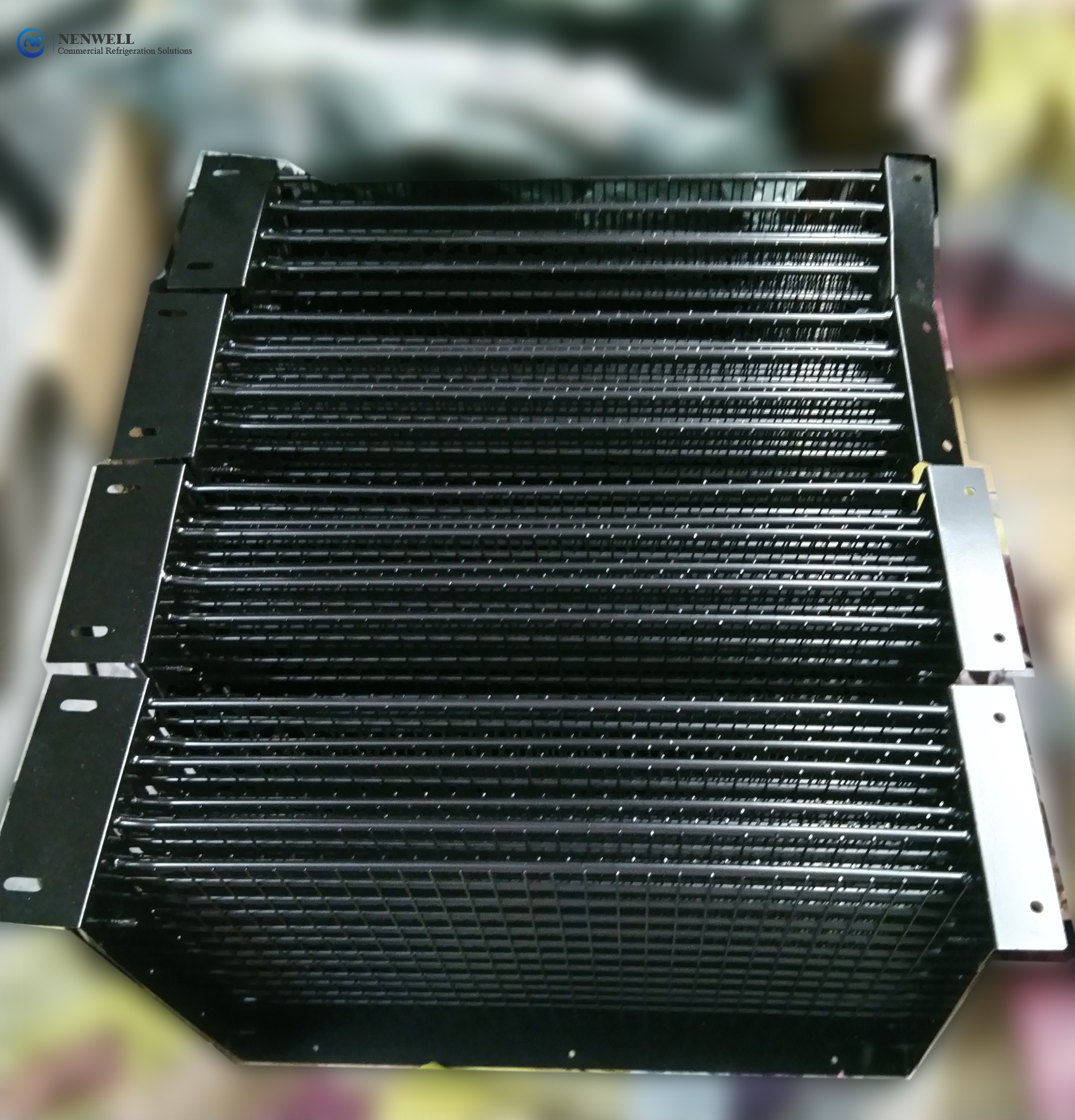 What is the principle of commercial freezer condenser refrigeration?