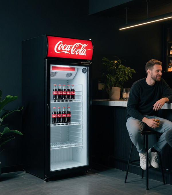 How much energy does a Coca – Cola upright cabinet consume?