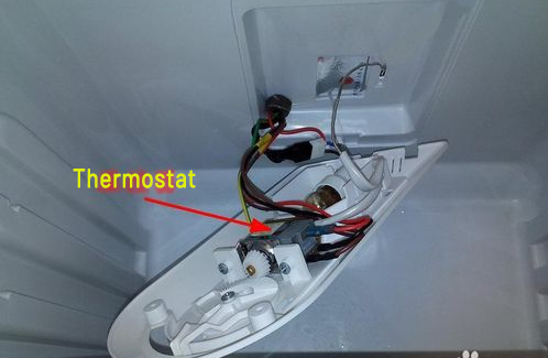 how to find the fridge thermostat from the lamp cover